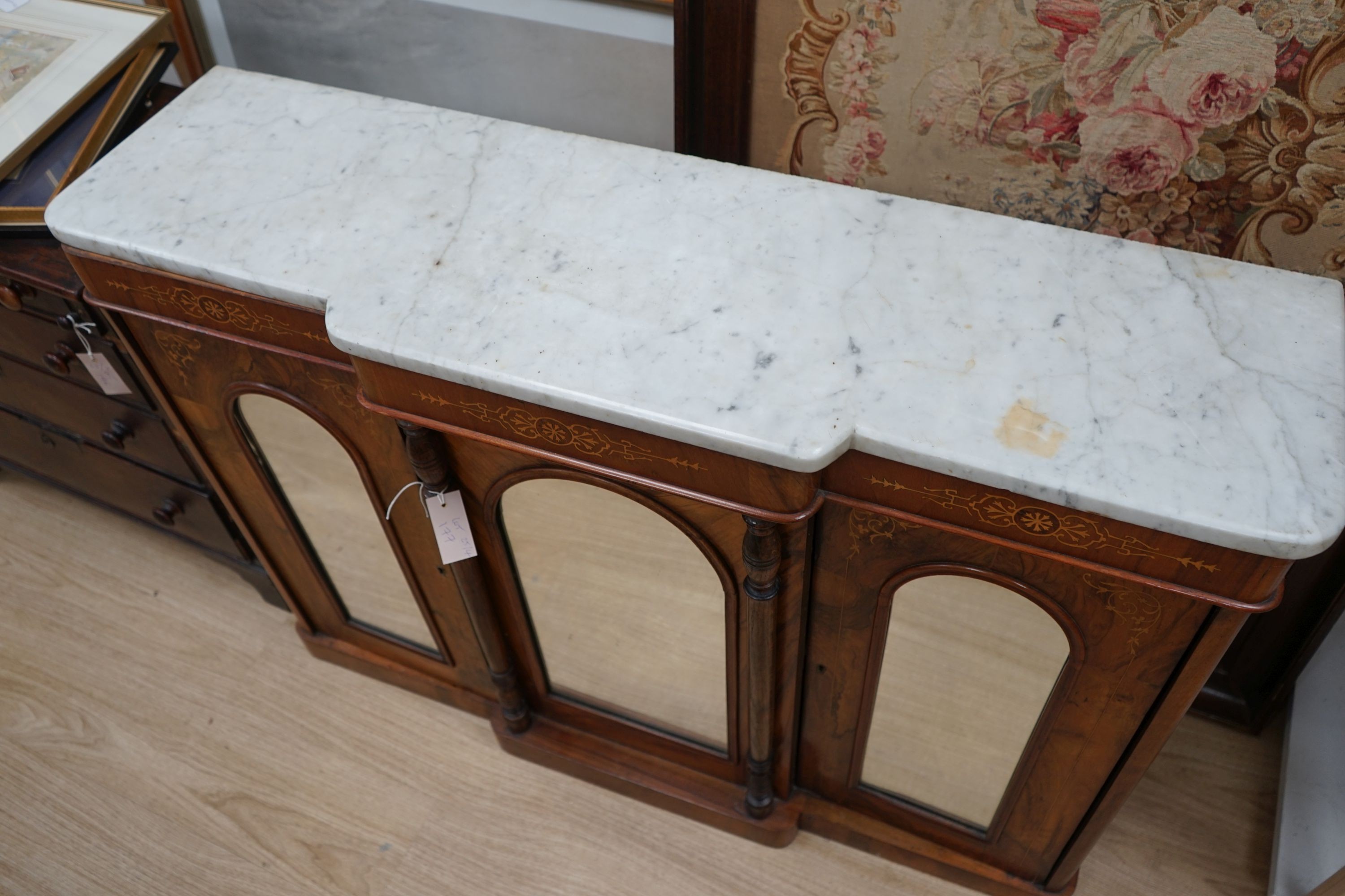 A Victorian inlaid walnut marble top breakfront mirrored side cabinet, width 120cm, depth 34cm, height 84cm